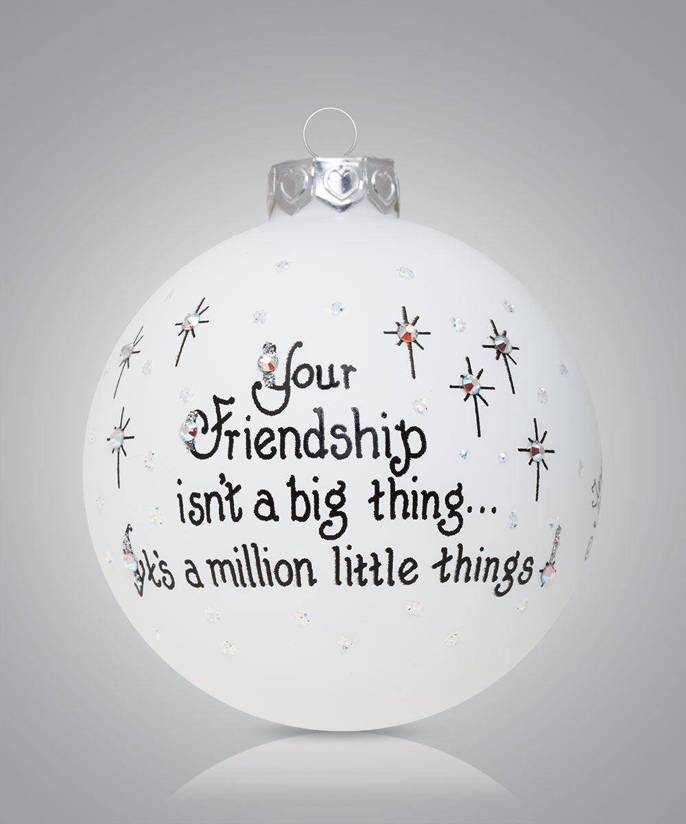 Hand-painted glass ornament with rocket and message “The sky is the limit for you”