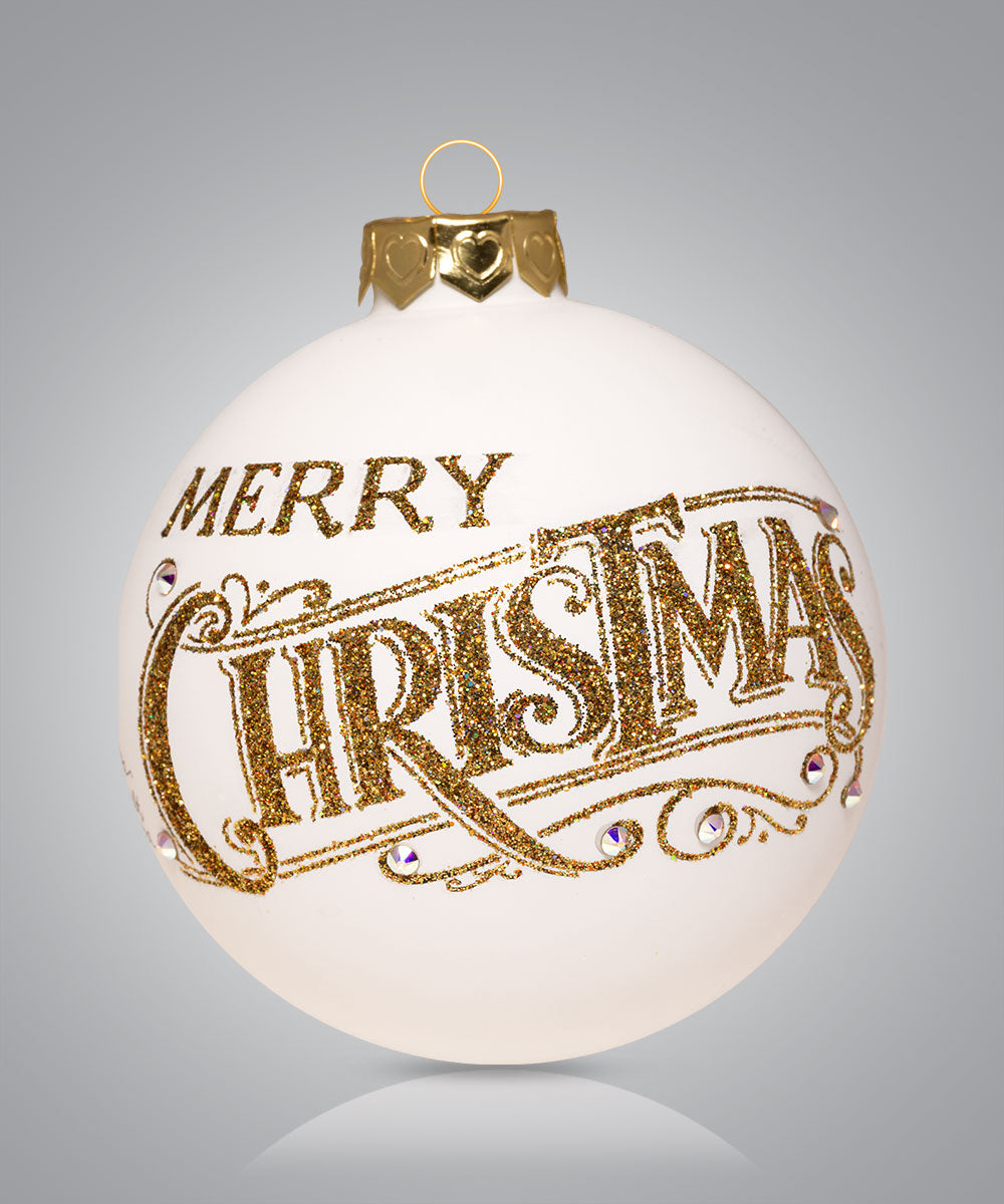 Hand-painted glass ornament with elegant gold script saying Merry Christmas