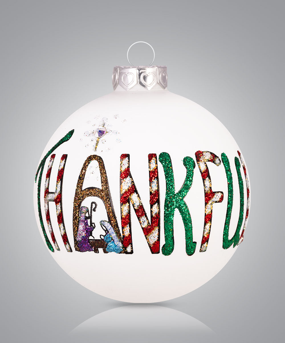 Hand-painted glass ornament with the word “THANKFUL” in decorative letters