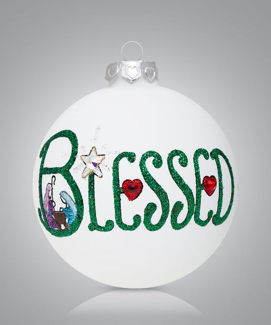 Hand-painted glass ornament with the word Blessed and nativity scene inside the B