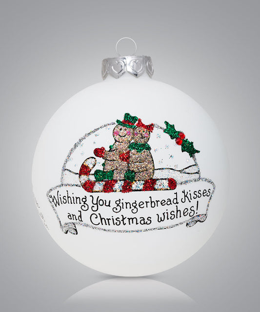 Hand-painted glass ornament with gingerbread cookie in snow globe and festive message