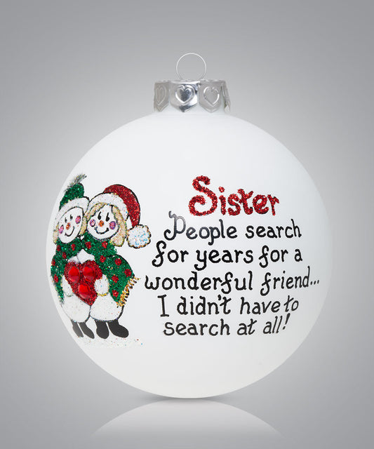 Hand-painted glass ornament with snowmen hugging and message about sisters being wonderful friends