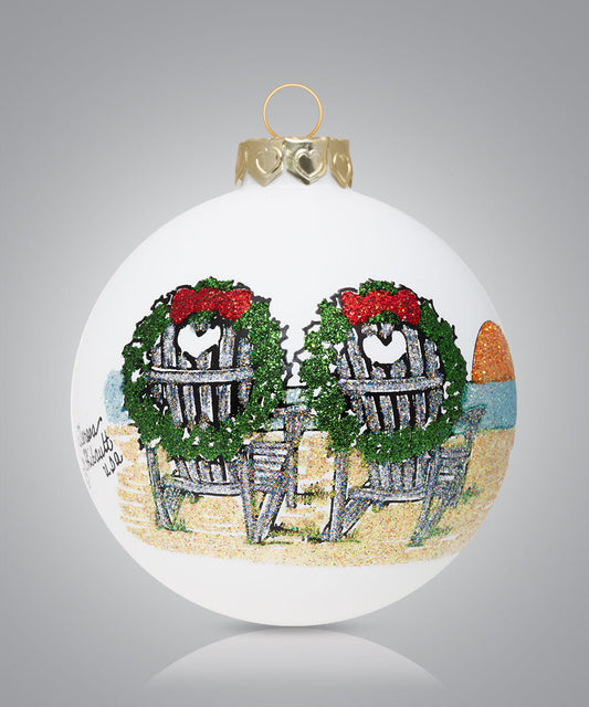 Hand-painted glass ornament with two Adirondack chairs on the beach adorned with wreaths