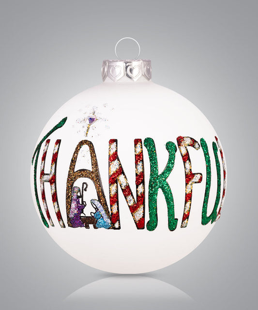 Hand-painted glass ornament with the word “THANKFUL” in decorative letters