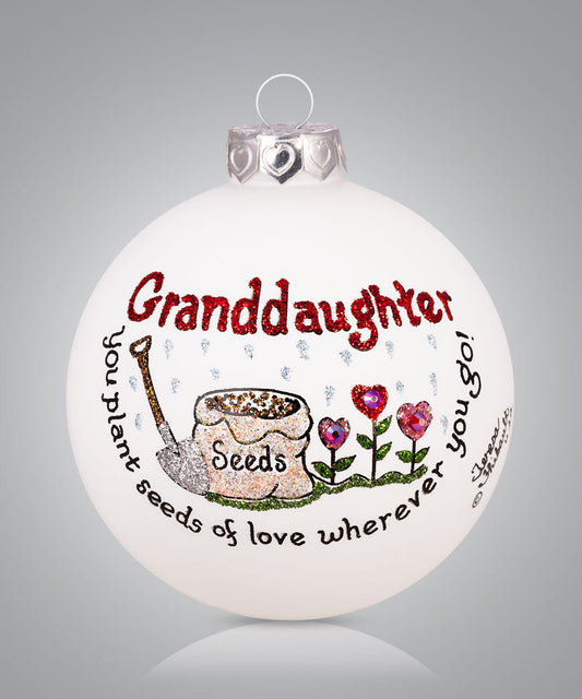 Hand-painted glass ornament with flowers and message about granddaughter planting seeds of love