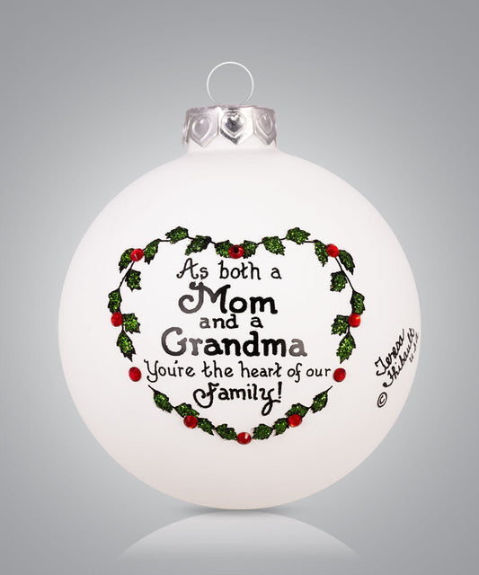Hand-painted glass ornament with holly heart and message for Mom and Grandma: “You’re the heart of our family”