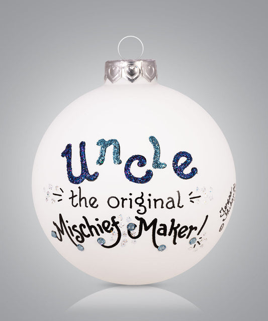 Hand-painted glass ornament with playful text calling uncle the original mischief maker