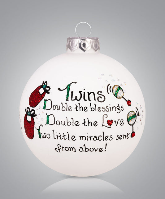 Hand-painted glass ornament for parents of twins with baby items and the phrase “Double the blessings, double the love”