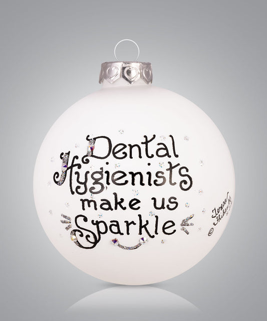Hand-painted glass ornament with toothbrush sparkle design and message for dental hygienists