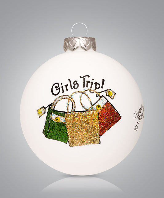 Hand-painted glass ornament with fall-colored purses and the phrase Girls Trip
